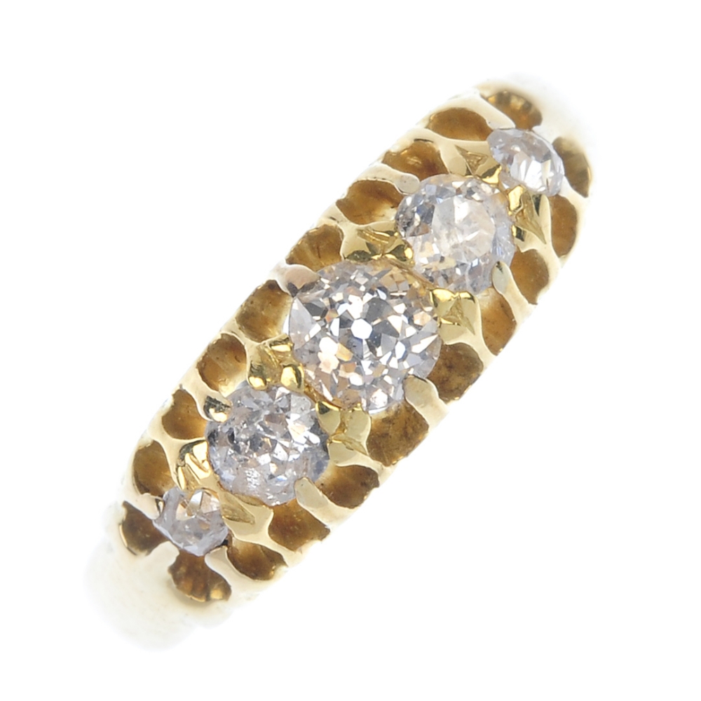 An early 20th century 18ct gold diamond five-stone ring. The graduated old-cut diamond line, to