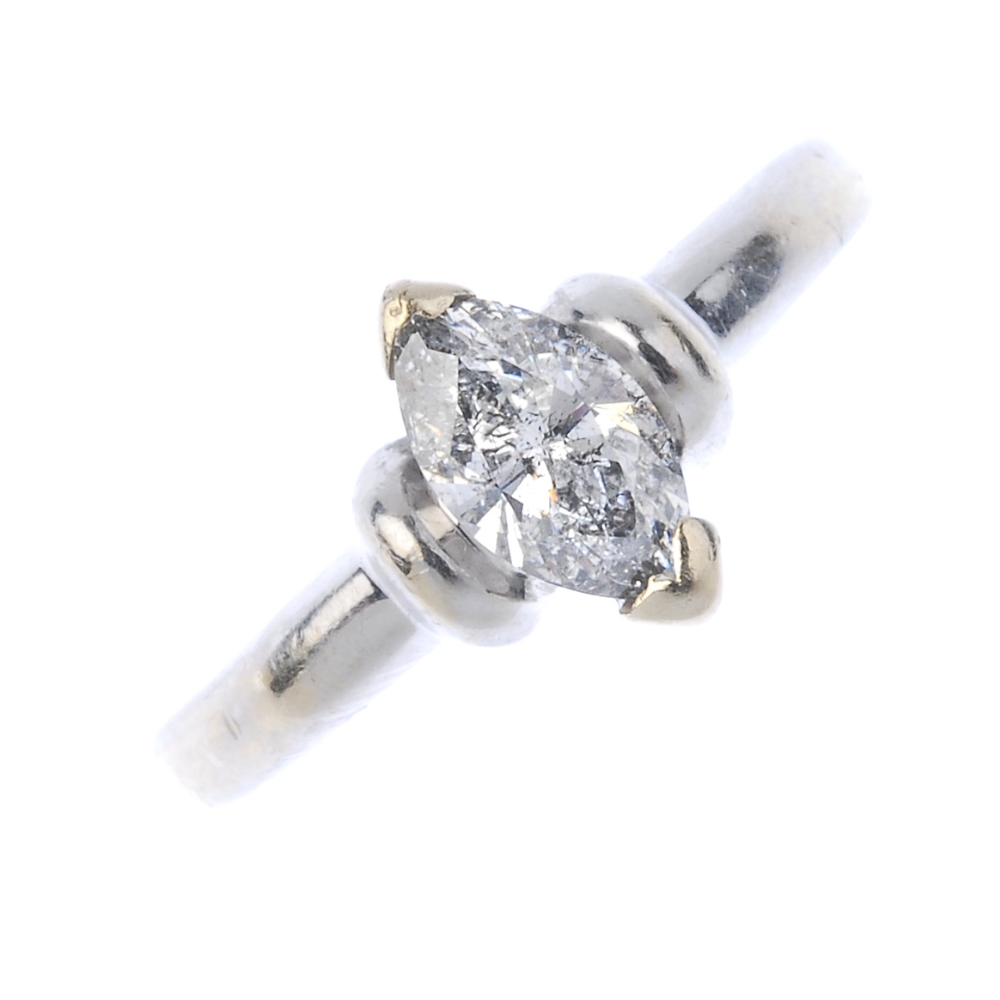 An 18ct gold diamond single-stone ring. The marquise-shape diamond, with curved bar sides and