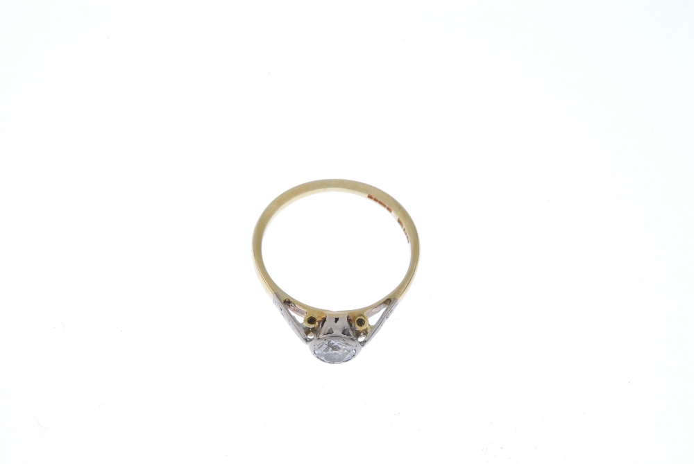 An 18ct gold diamond single-stone ring. The circular-cut diamond, to the foliate engraved - Image 2 of 3