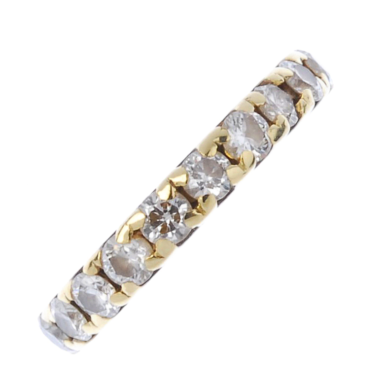 (174110) An 18ct gold diamond half-circle eternity ring. Designed as a line of brilliant-cut