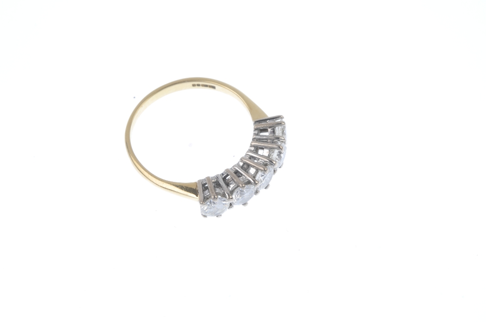 An 18ct gold diamond five-stone ring. The brilliant-cut diamond line, to the plain band. Estimated - Image 3 of 4