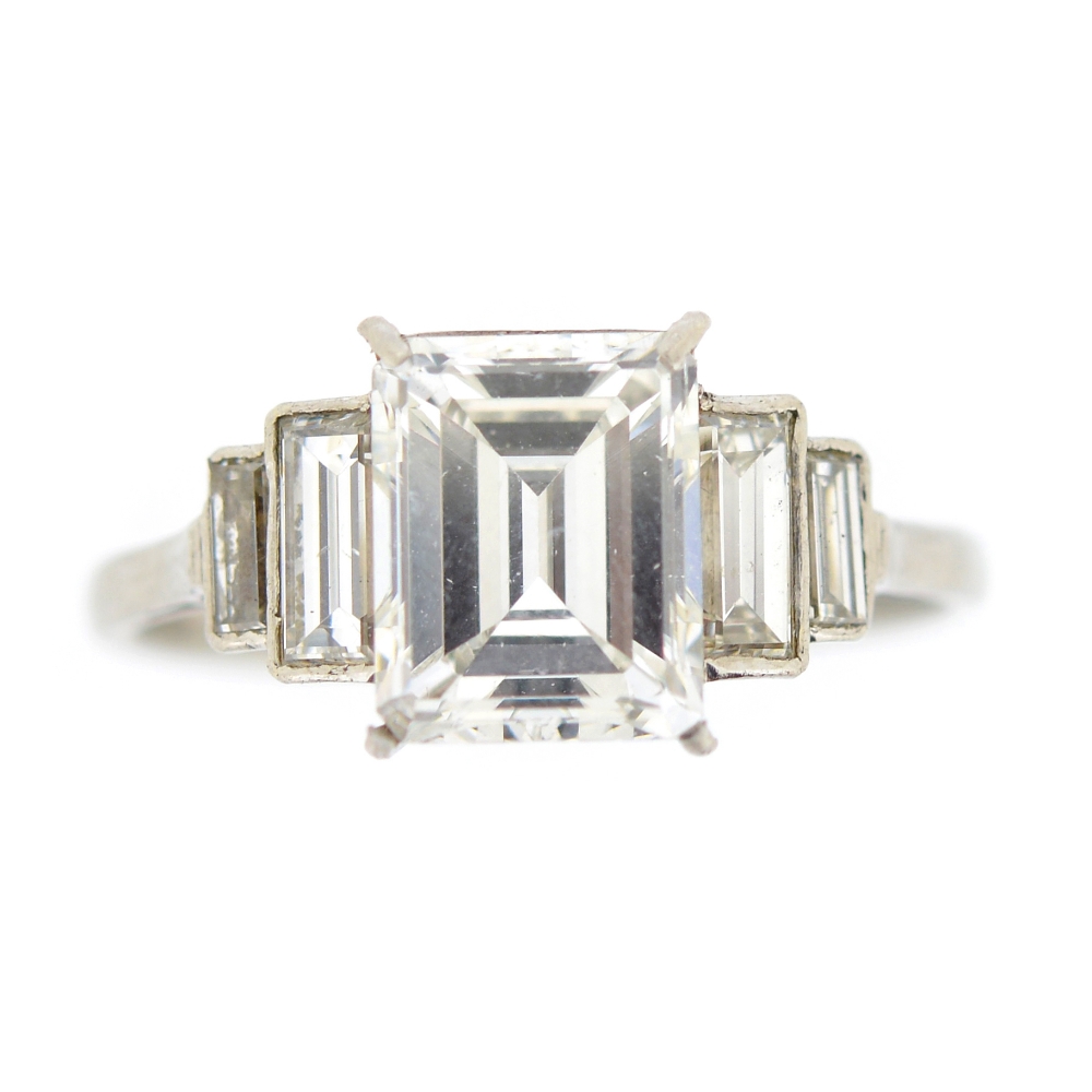 A diamond single-stone ring. The rectangular-shape diamond, weighing 2.39cts, to the graduated