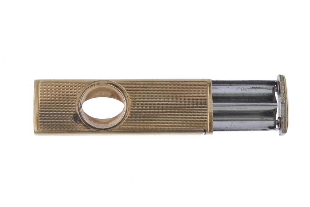 A 9ct gold cigar cutter. With engine turned case. Hallmarks for Birmingham, 1964. Length 5.5cms. - Image 3 of 3