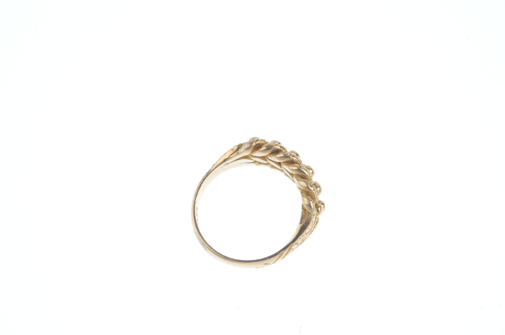 An Edwardian 18ct gold keeper ring. The bead highlight and vari-texture interwoven panel, to the - Image 3 of 3