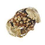 A mid 19th century Scottish 22ct gold dress ring. Designed as a bunch of grapes, with asymmetric
