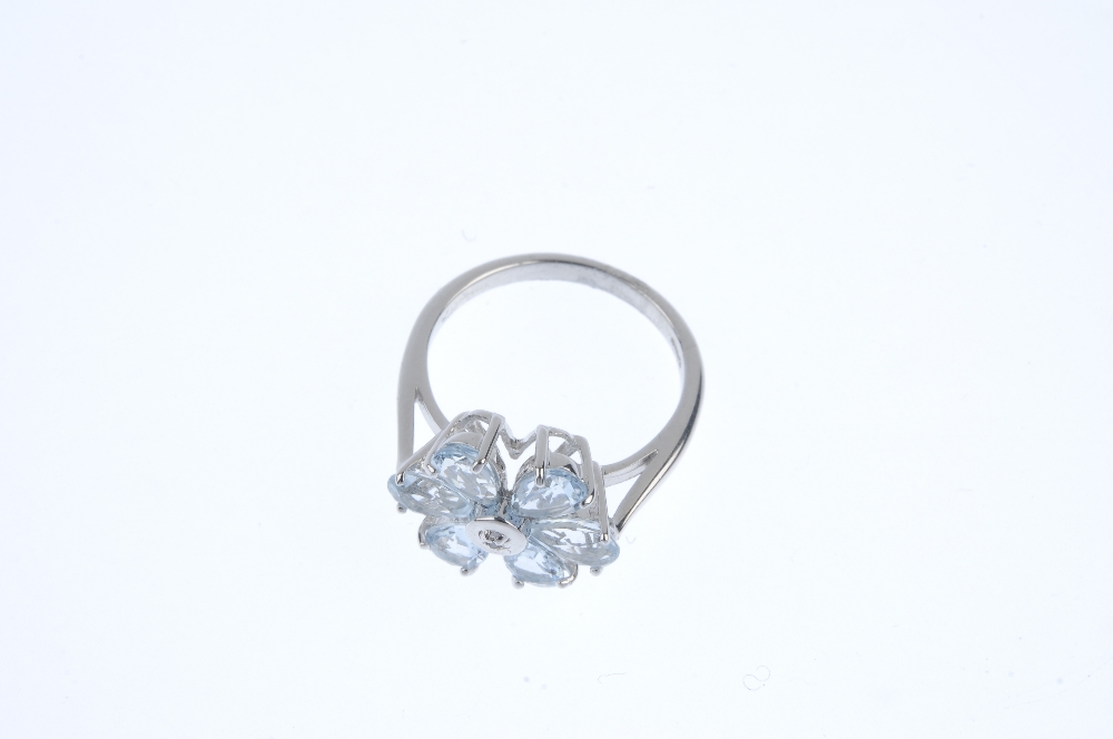 A 9ct gold aquamarine floral cluster ring. The single-cut diamond collet, within a pear-shape - Image 2 of 3