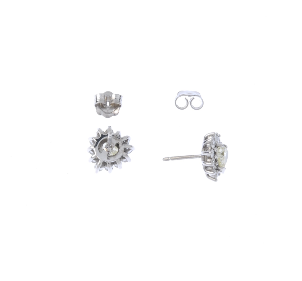 (194424) A pair of 18ct gold coloured diamond and diamond cluster ear studs. Each designed as a - Image 2 of 3