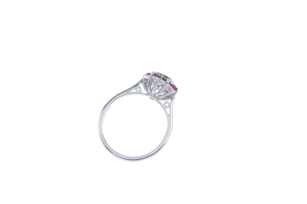 An 18ct gold ruby and diamond floral cluster ring. The single-cut diamond, within a circular-shape - Image 3 of 3