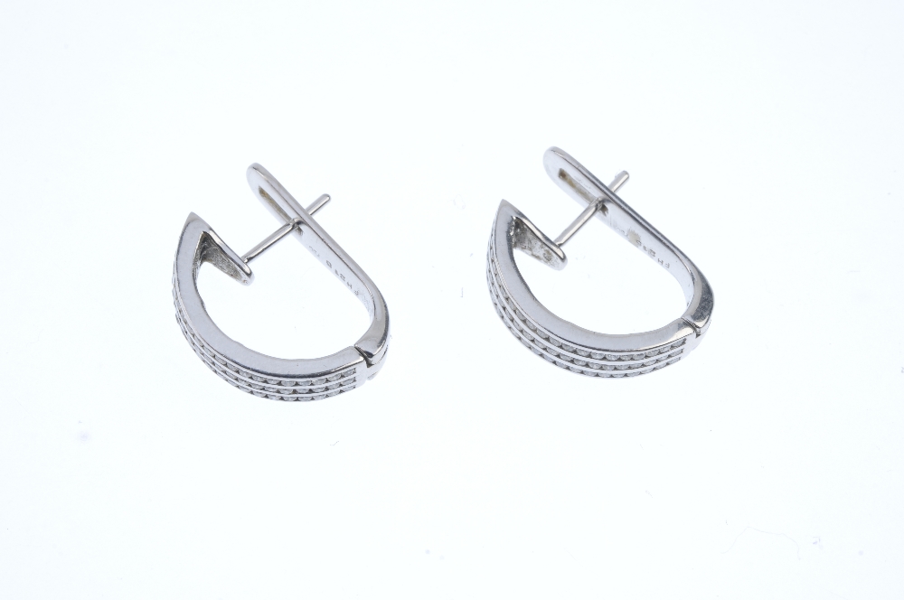 A pair of diamond earrings. Each designed as three brilliant-cut diamond lines, inset to the - Image 2 of 3