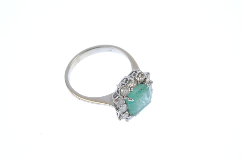 An emerald and diamond cluster ring. The square-shape emerald, within a brilliant-cut diamond - Image 3 of 4