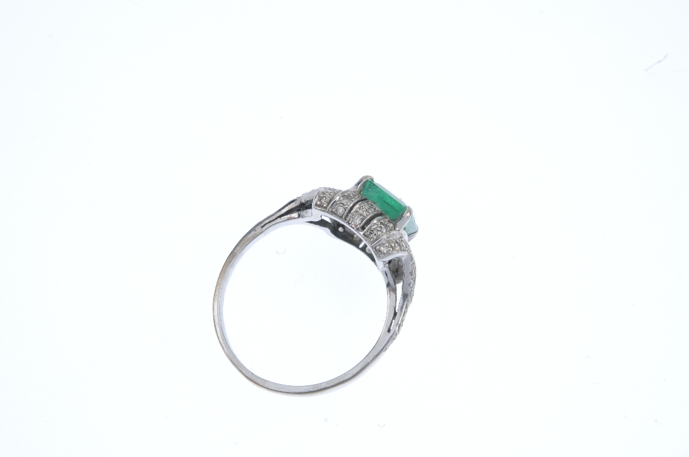 An emerald and diamond dress ring. The rectangular-shape emerald, within a pave-set diamond - Image 3 of 3