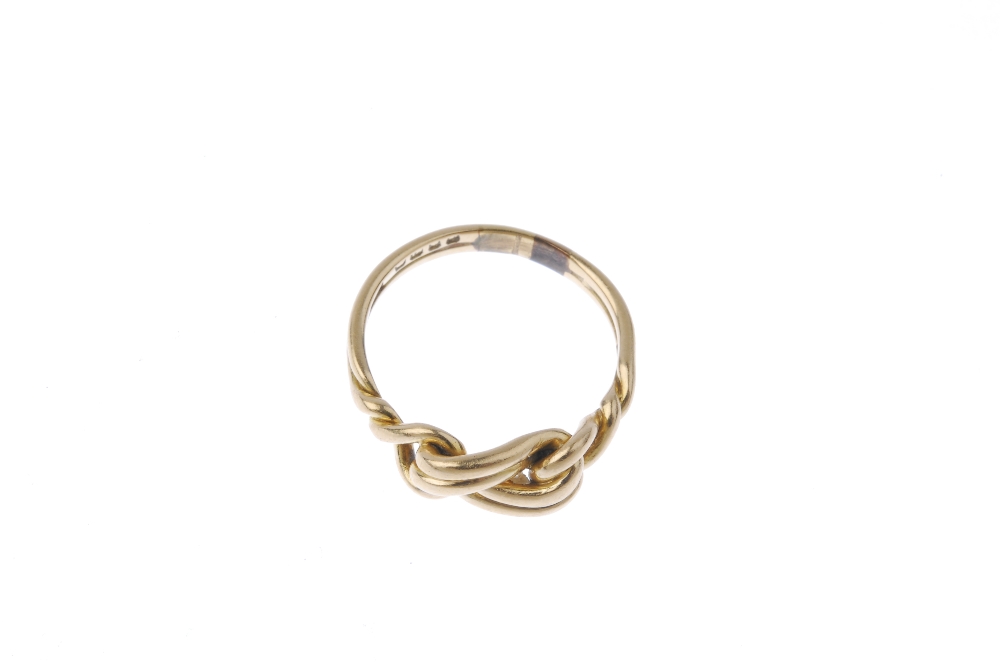 An early 20th century 18ct gold knot ring. Designed as a knot, with crossover shoulders and - Image 2 of 3