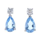 A pair of 18ct gold aquamarine and diamond earrings. Each designed as a pear-shape aquamarine,