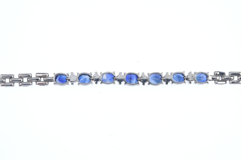 A sapphire and diamond bracelet. Designed as a series of oval-shape sapphires, with brilliant-cut - Image 2 of 3