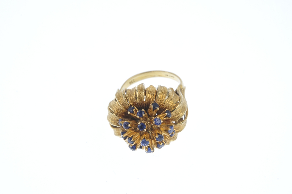 A mid 20th century 18ct gold sapphire flower ring. The circular-shape sapphire spray, within a - Image 2 of 3