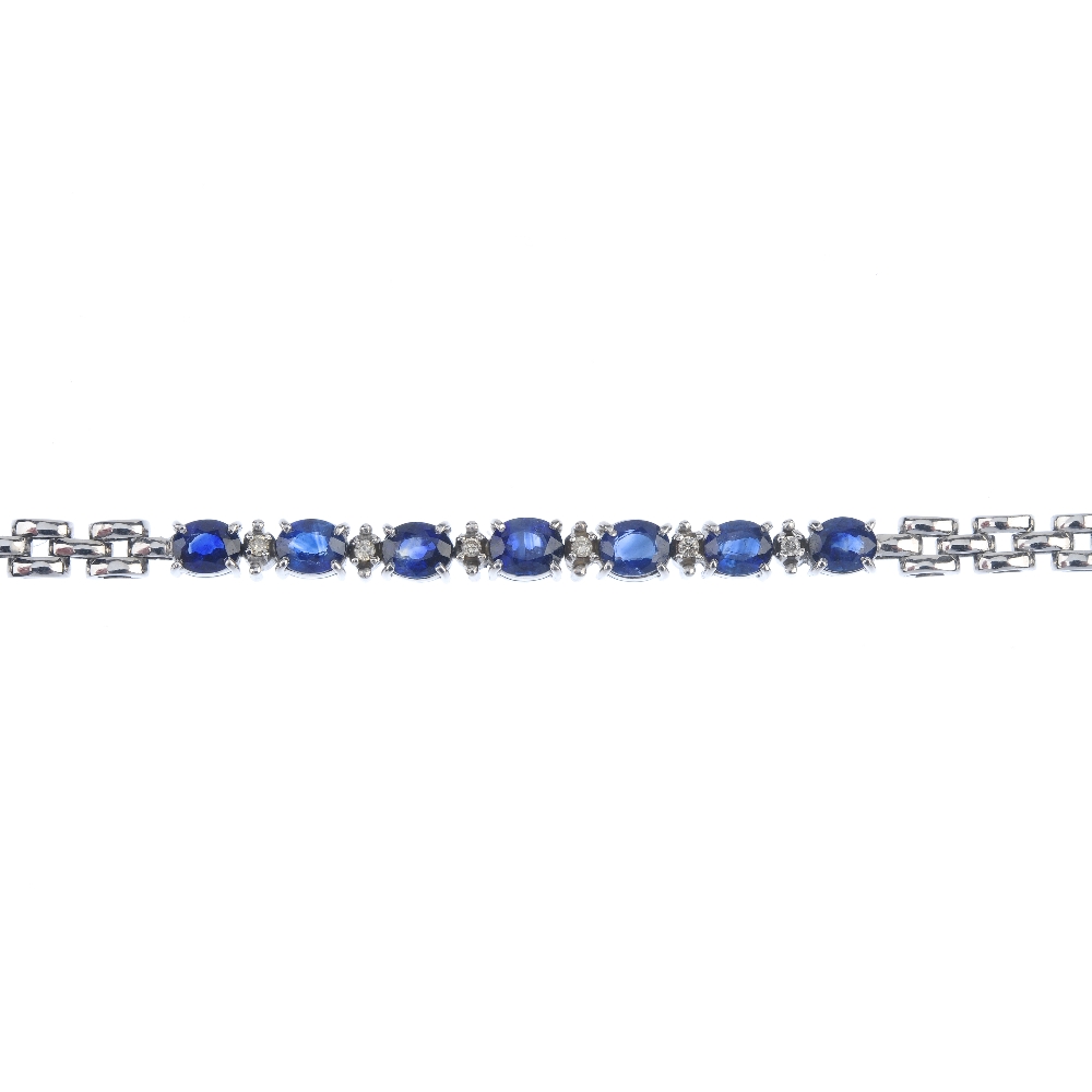 A sapphire and diamond bracelet. Designed as a series of oval-shape sapphires, with brilliant-cut