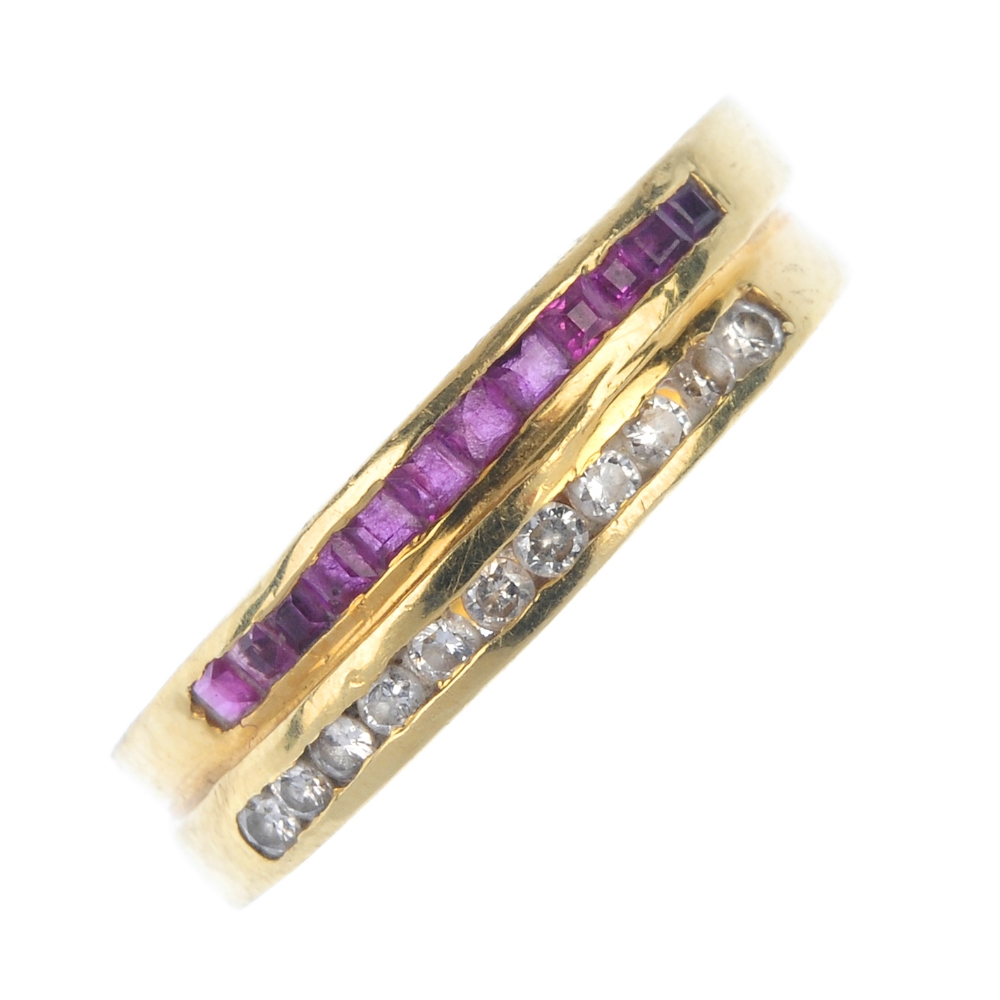A ruby and diamond half-circle eternity ring. Comprising two off-set bands, each inset with