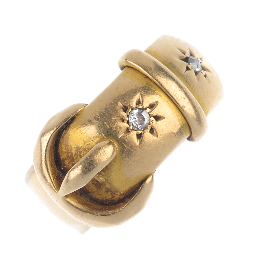 An early 20th century 18ct gold diamond dress ring. Designed as a buckle, with old-cut diamond