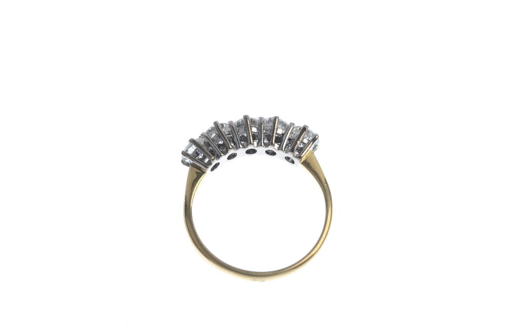 An 18ct gold diamond five-stone ring. The brilliant-cut diamond line, to the plain band. Estimated - Image 4 of 4