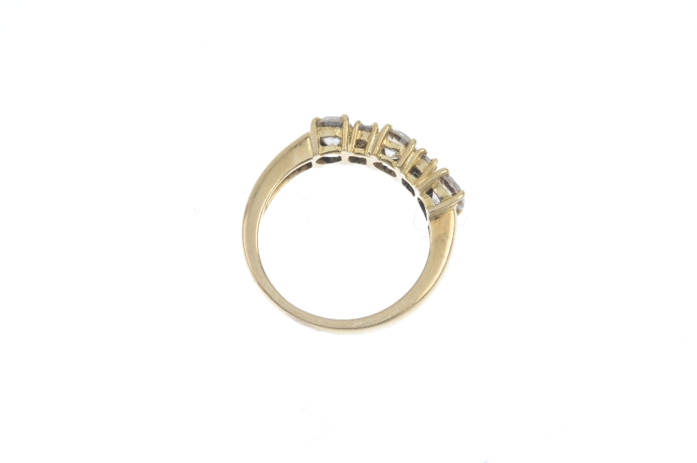 An 18ct gold diamond three-stone ring. The brilliant-cut diamond line, with square-shape diamond - Image 3 of 3