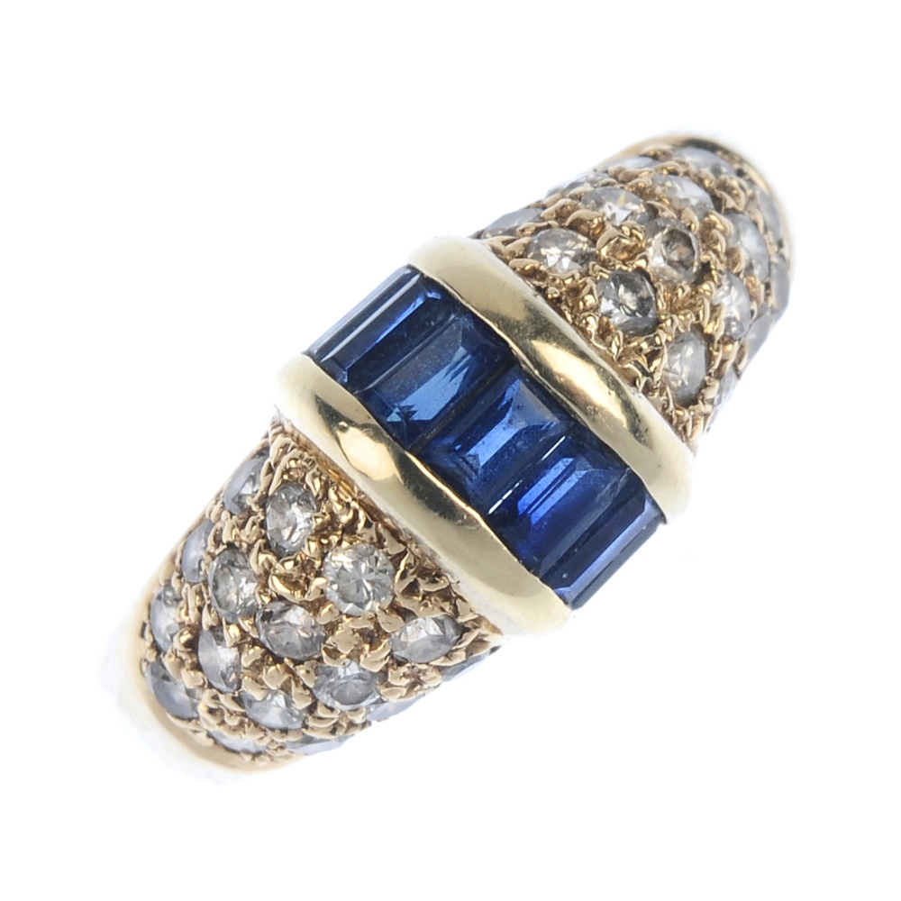 A sapphire and diamond dress ring. The rectangular-shape sapphire line, with bar sides, to the