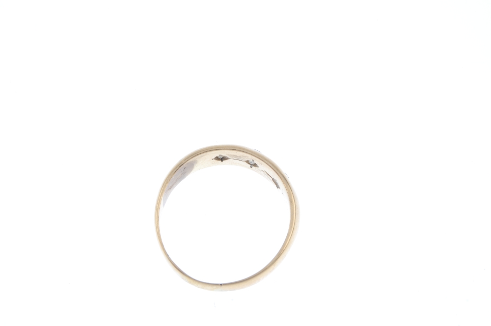 A mid 20th century diamond three-stone ring. The graduated brilliant-cut diamond line, inset to - Image 3 of 3