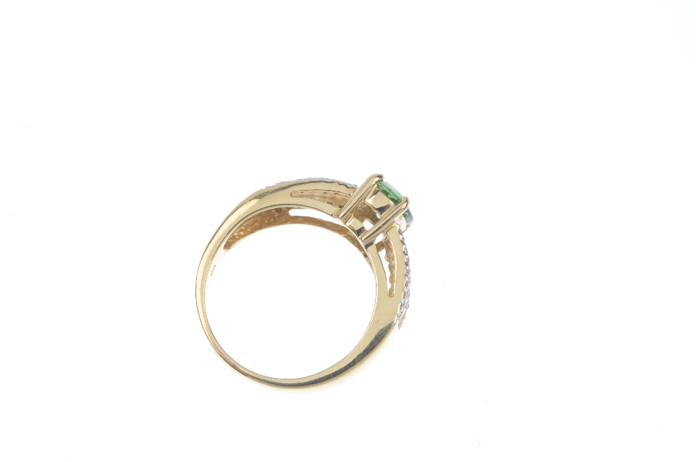 An 18ct gold tourmaline and diamond dress ring. The oval-shape green tourmaline, to the square-shape - Image 3 of 3