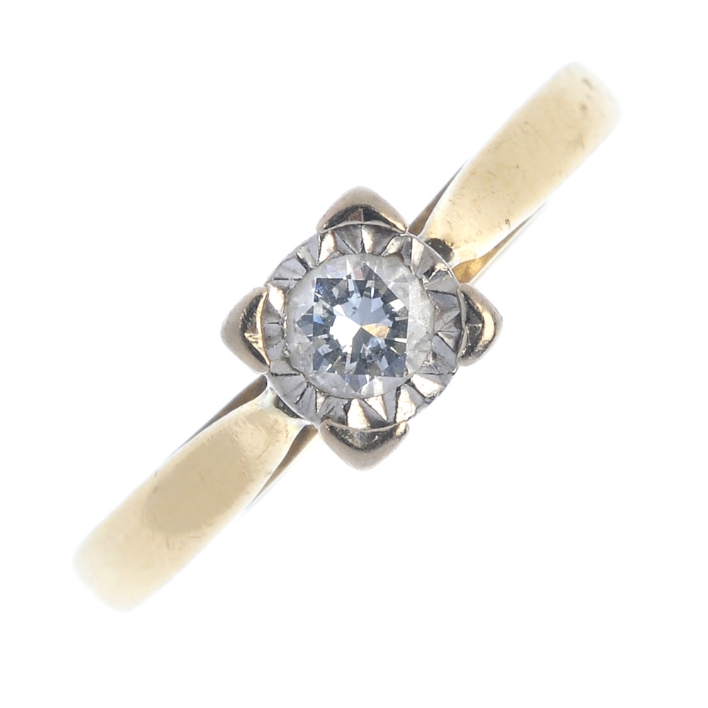 An 18ct gold diamond single-stone ring. The brilliant-cut diamond, within an illusion setting, to