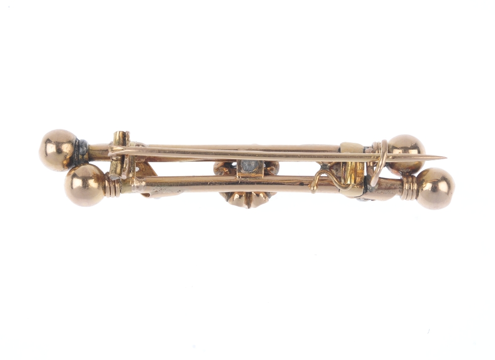 A late 19th century gold diamond and split pearl bar brooch. The rose-cut diamond, to the twin off- - Image 2 of 2