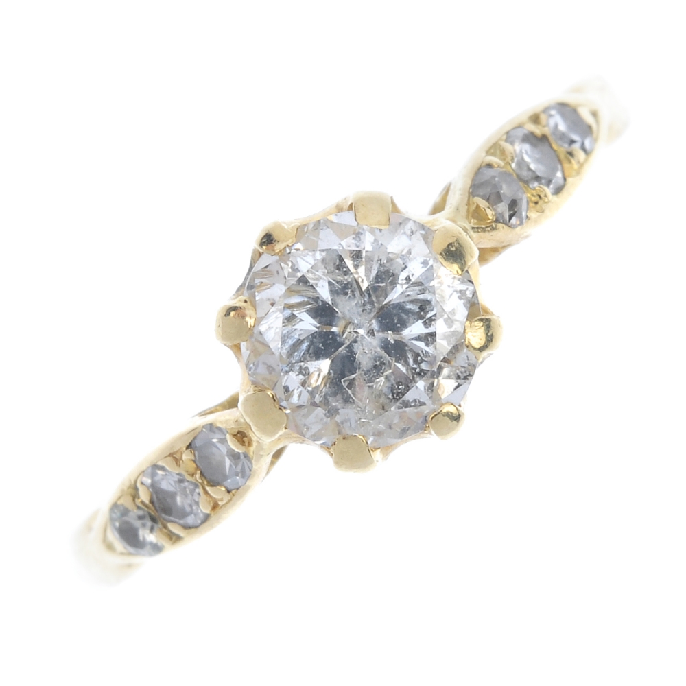 A diamond single-stone ring. The brilliant-cut diamond, to the single-cut diamond marquise-shape