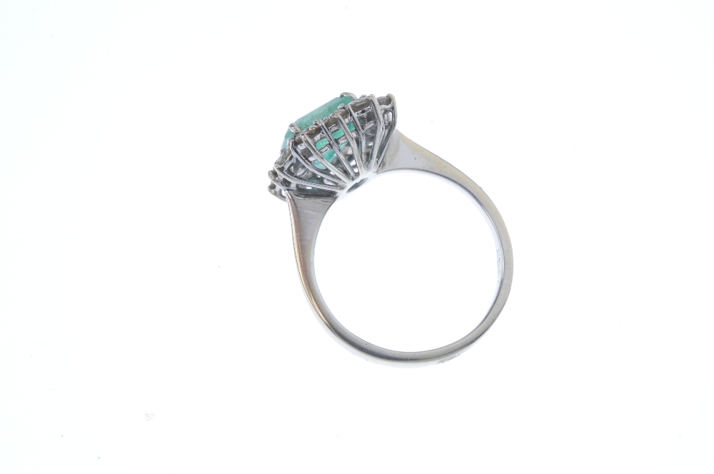 An emerald and diamond cluster ring. The square-shape emerald, within a brilliant-cut diamond - Image 4 of 4