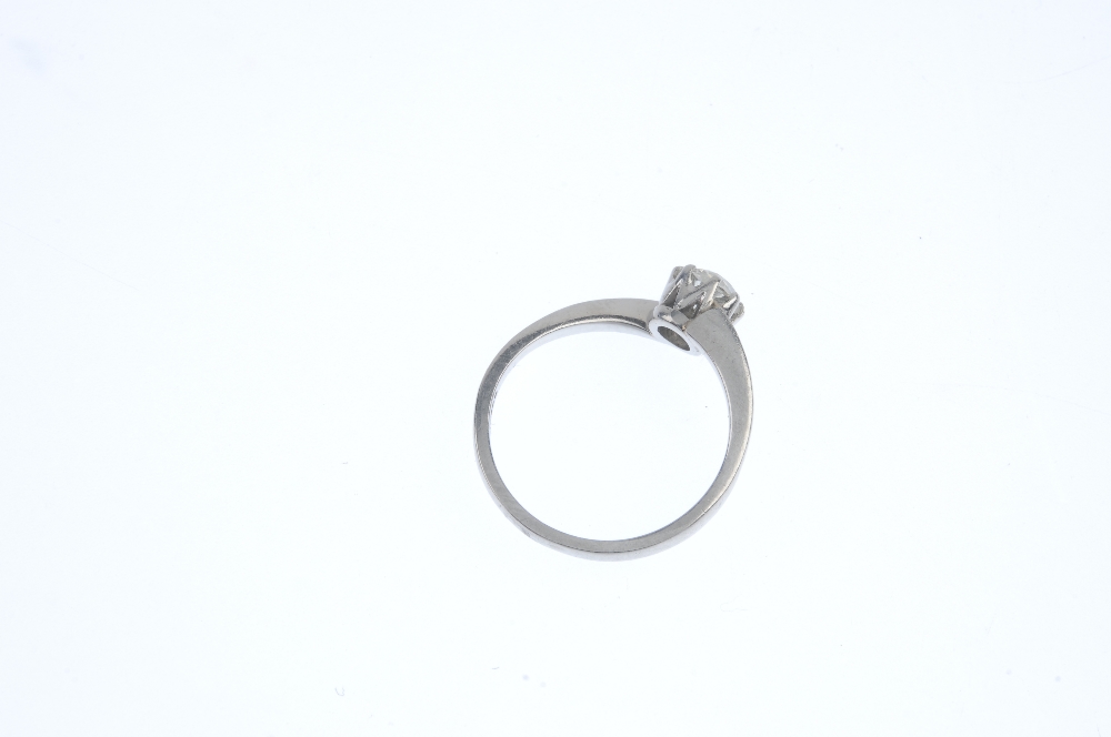 A platinum diamond single-stone ring. The old-cut diamond, to the asymmetric shoulders and plain - Image 3 of 3