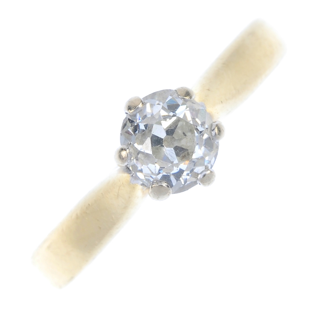 An 18ct gold diamond single-stone ring. The old-cut diamond, to the tapered band. Estimated