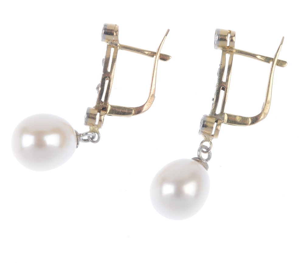 A pair of cultured pearl and diamond ear pendants. Each designed as a cultured pearl, suspended from - Image 2 of 2