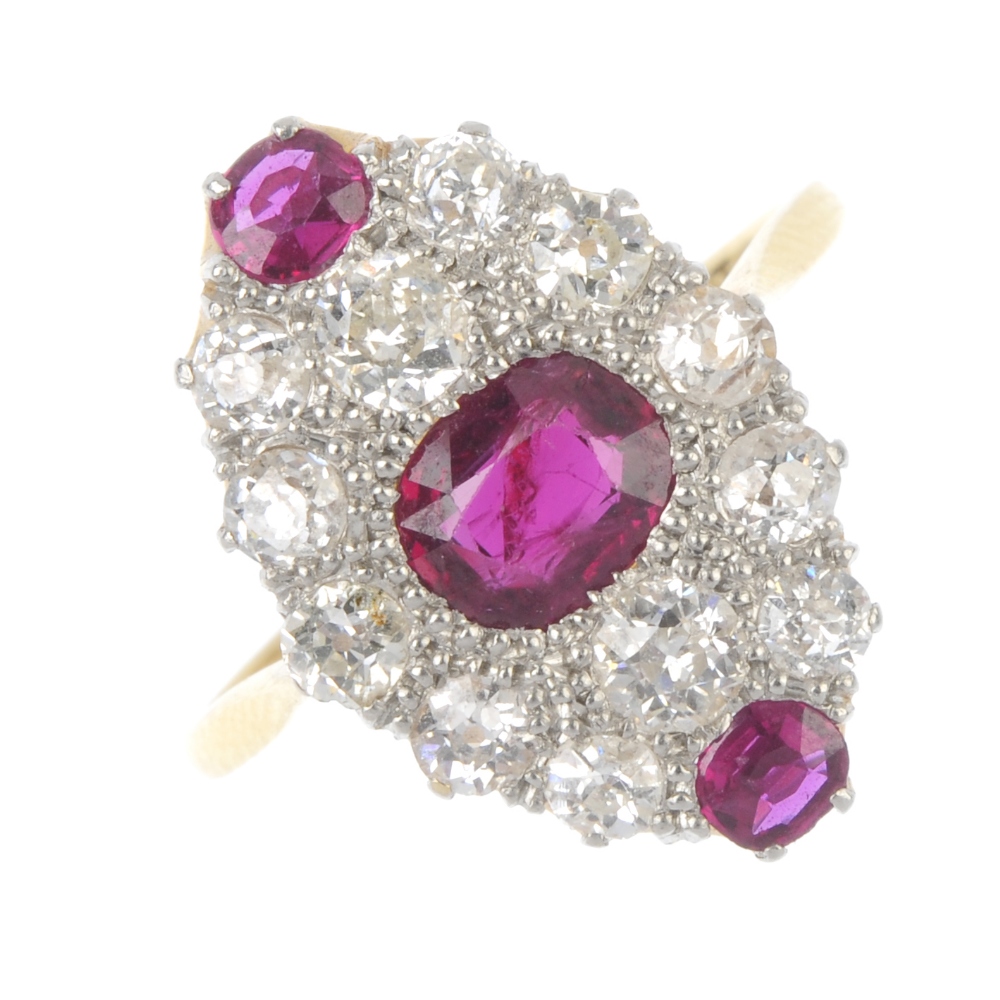 A mid 20th century 18ct gold and platinum, ruby and diamond dress ring. Of marquise-shape outline,