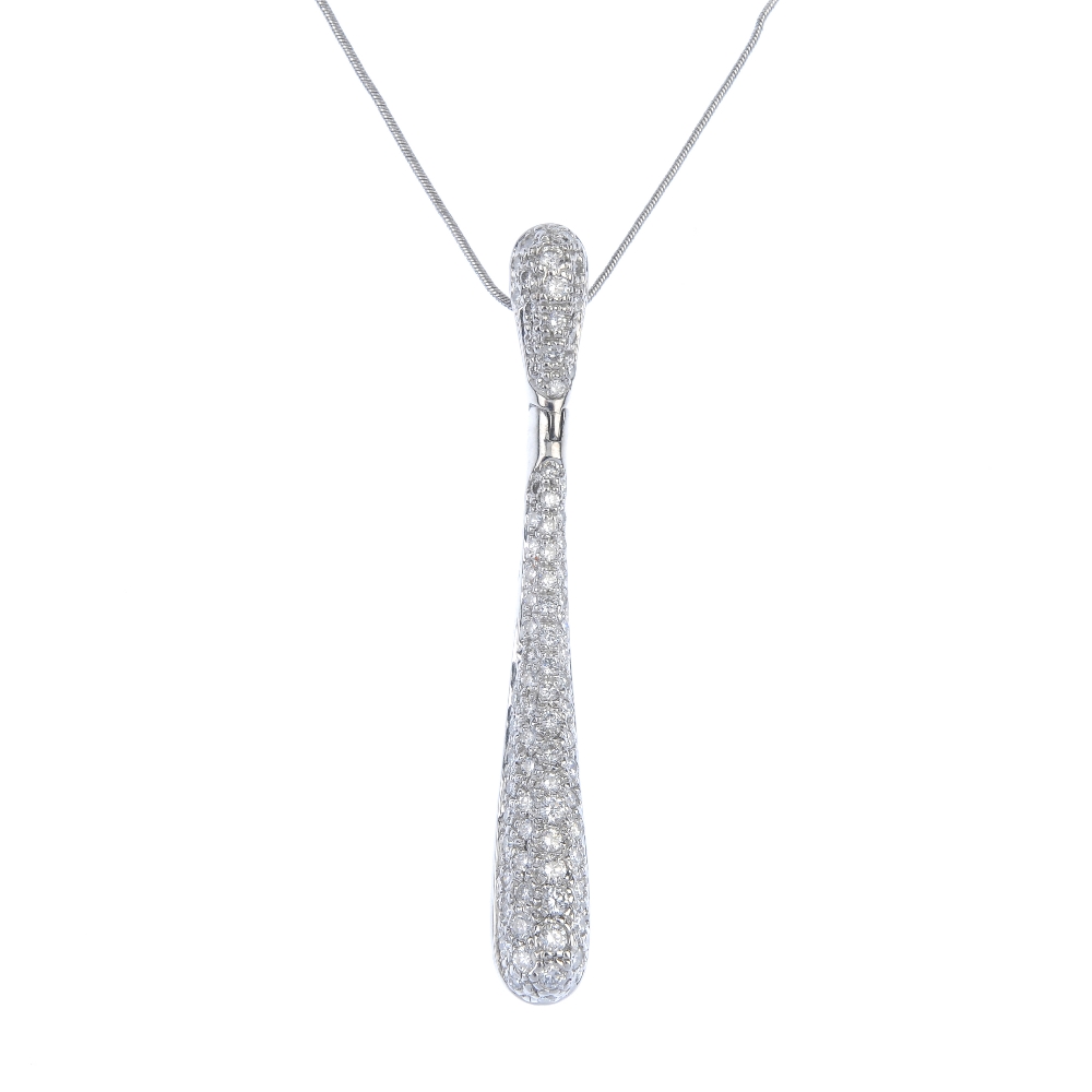 A diamond pendant. The pave-set diamond tapered drop, hinged to the similarly-set tapered