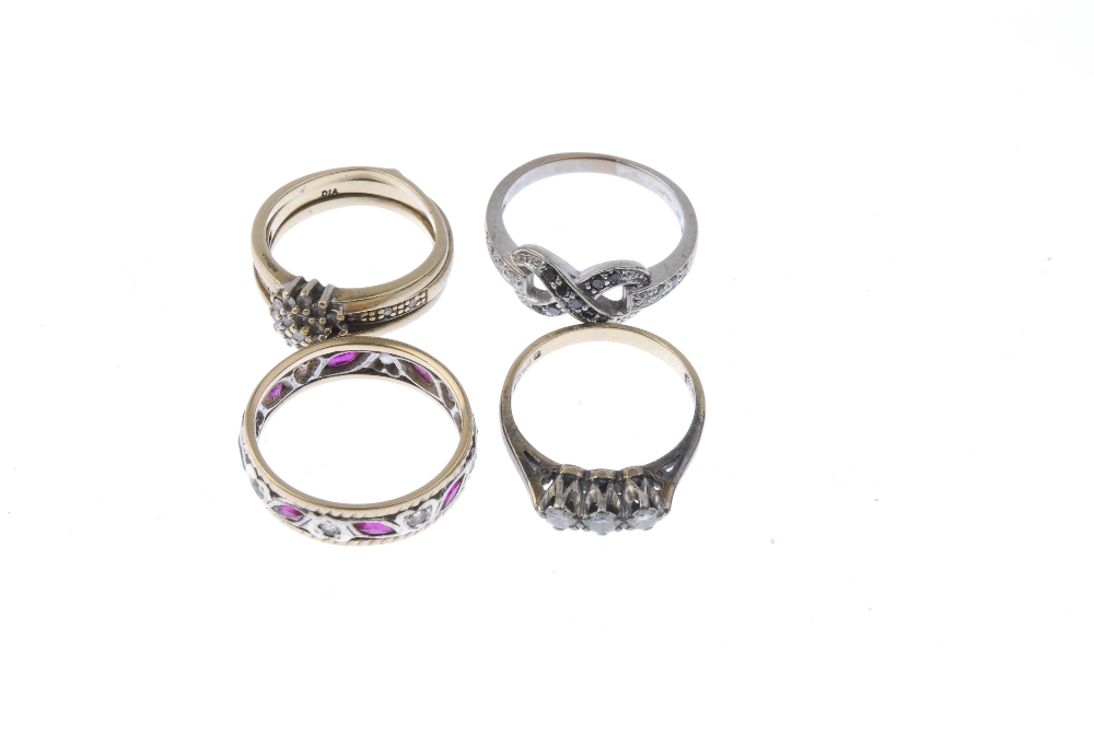 A selection of four 9ct gold gem-set rings. To include a diamond three-stone ring, a diamond cluster - Image 2 of 3