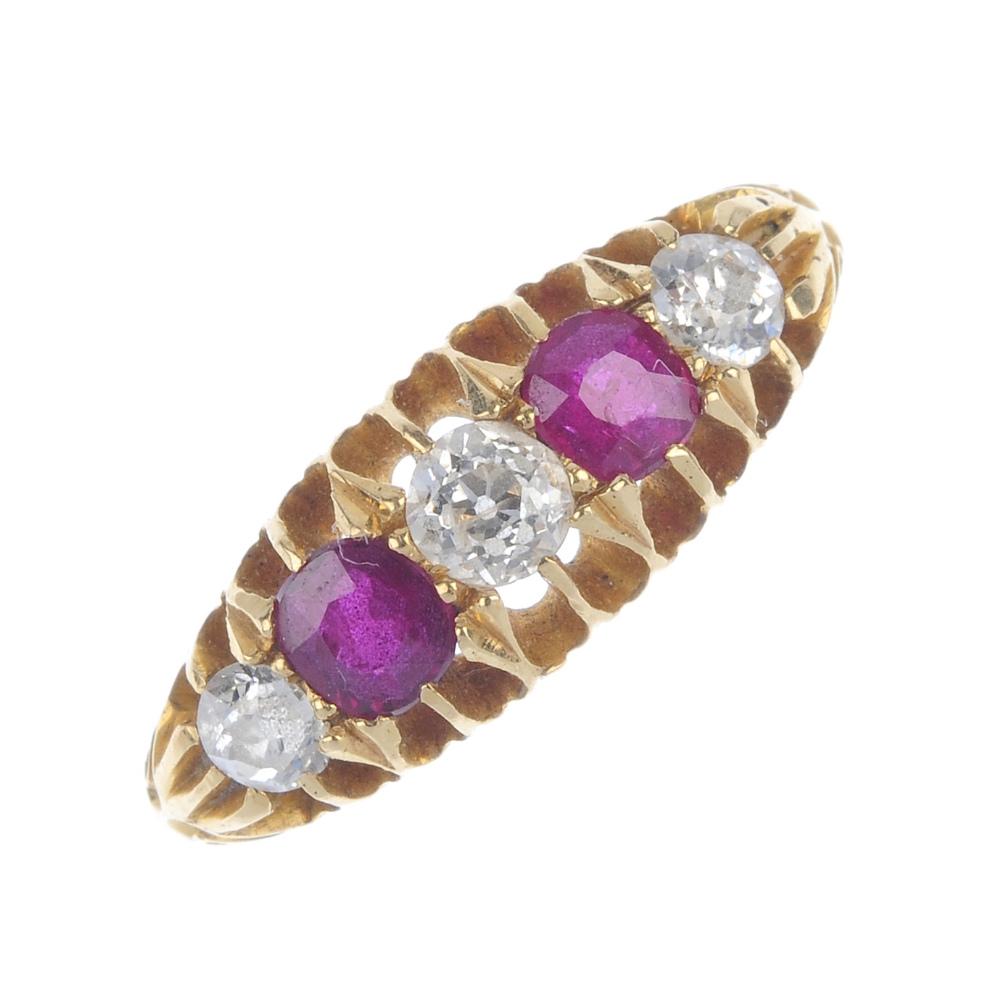 An early 20th century 18ct gold ruby and diamond five-stone ring. The alternating circular-shape