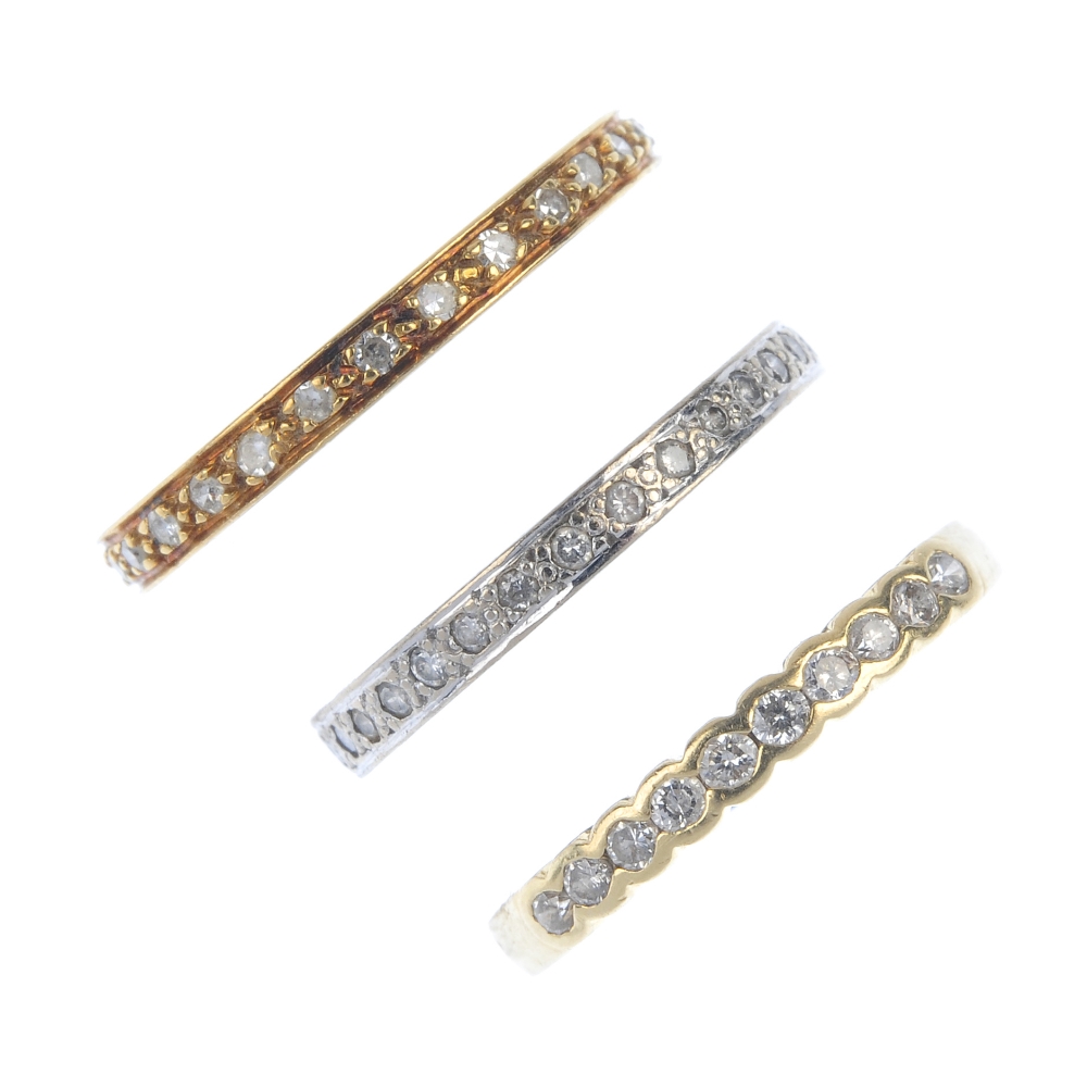 A selection of three diamond eternity rings. To include an 18ct gold brilliant-cut diamond full-