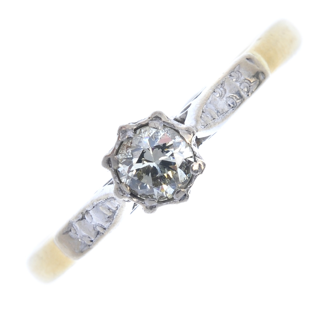 A mid 20th century 18ct gold diamond single-stone ring. The brilliant-cut diamond, to the bi-colour,