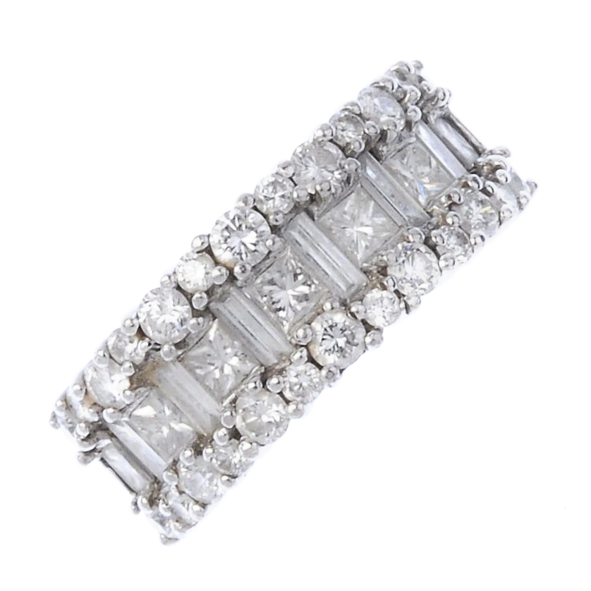 (187921) A diamond dress ring. Designed as a row of alternating square-shape and baguette-cut