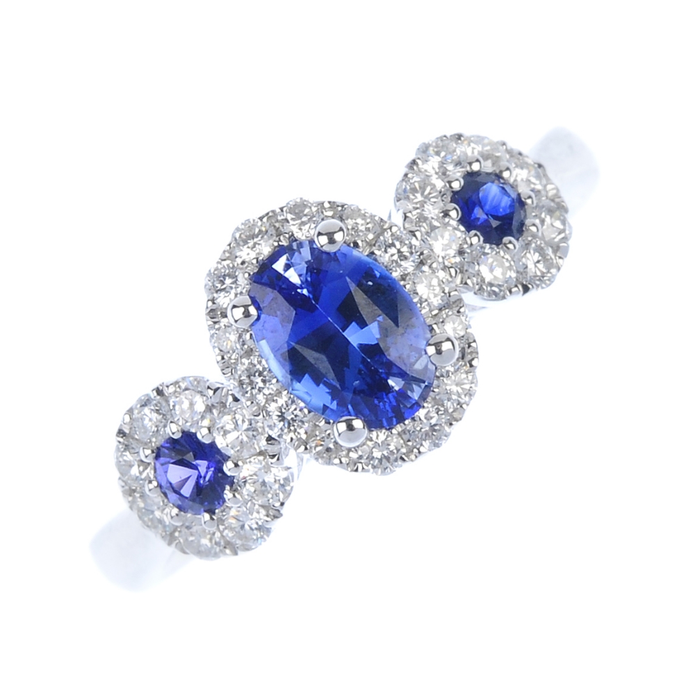 * A sapphire and diamond triple cluster ring. The three oval and circular-shape sapphires, each