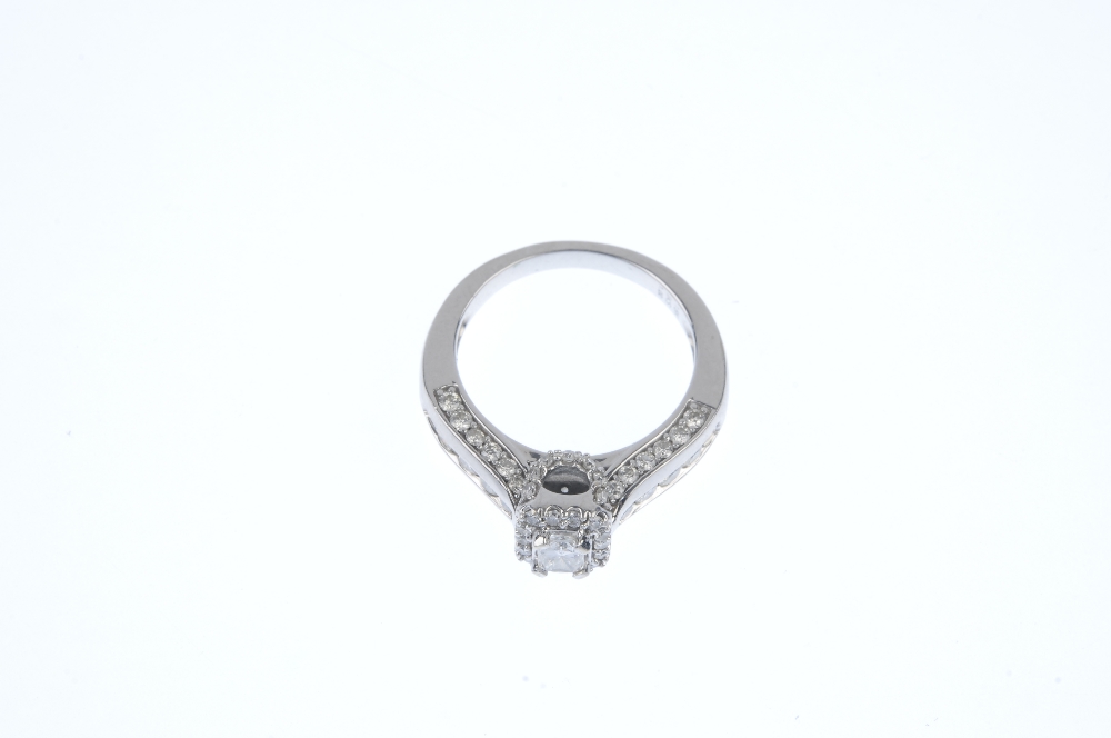 An 18ct gold diamond dress ring. The rectangular-shape diamond, within a brilliant-cut diamond - Image 2 of 3