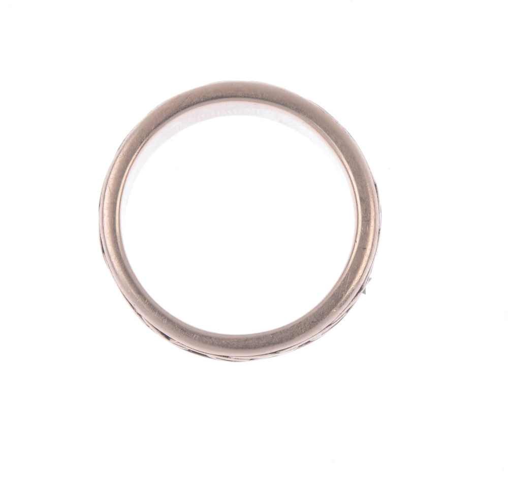 CLOGAU - a 9ct gold 'eternal love' eternity ring. The textured band, with raised stylised knot motif - Image 2 of 2