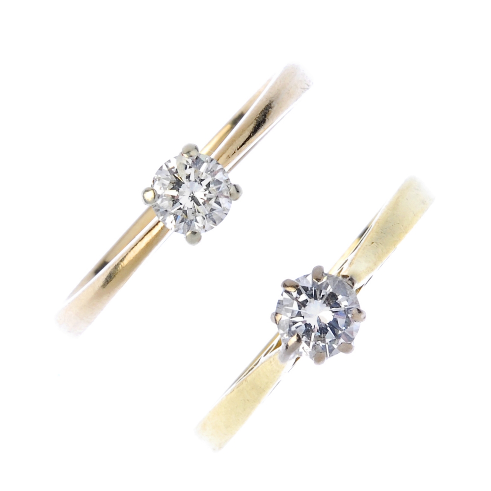 Two gold diamond single-stone rings. Each designed as a brilliant-cut diamond, to the tapered