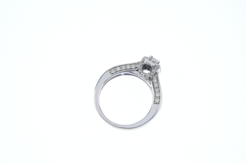 An 18ct gold diamond dress ring. The rectangular-shape diamond, within a brilliant-cut diamond - Image 3 of 3