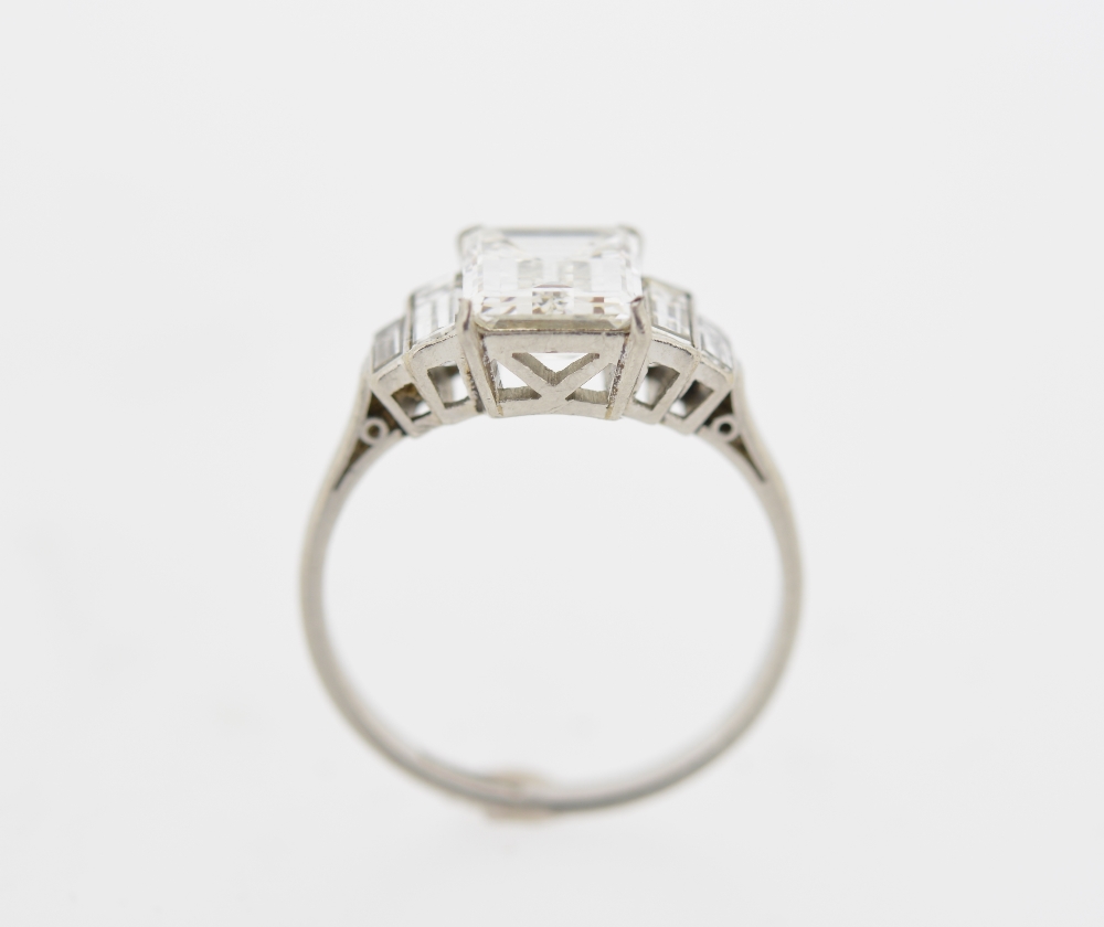 A diamond single-stone ring. The rectangular-shape diamond, weighing 2.39cts, to the graduated - Image 2 of 4