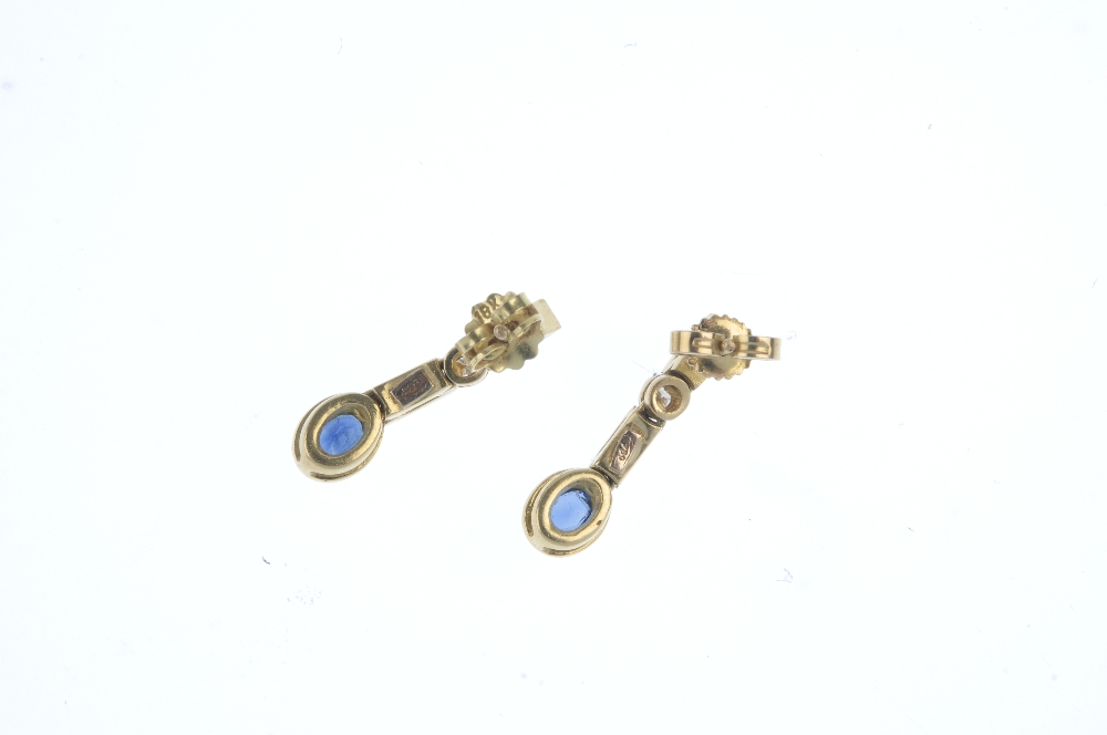 A pair of sapphire and diamond ear pendants. Each designed as an oval-shape sapphire collets, - Image 2 of 2