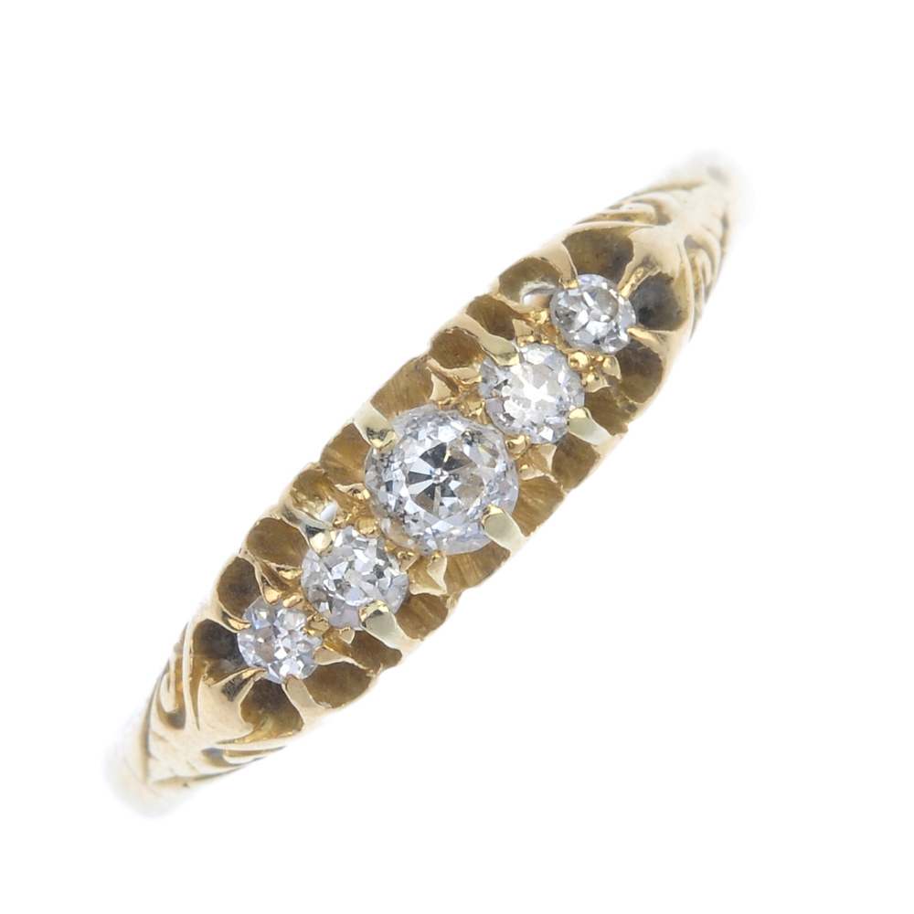 An early 20th century 18ct gold diamond five-stone ring. The graduated old-cut diamonds, to the