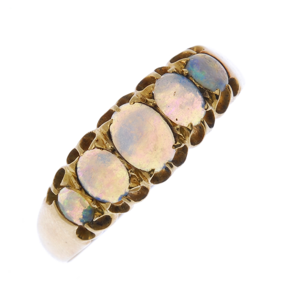 An Edwardian 18ct gold opal five-stone ring. The oval-shape opal cabochon graduated line, to the